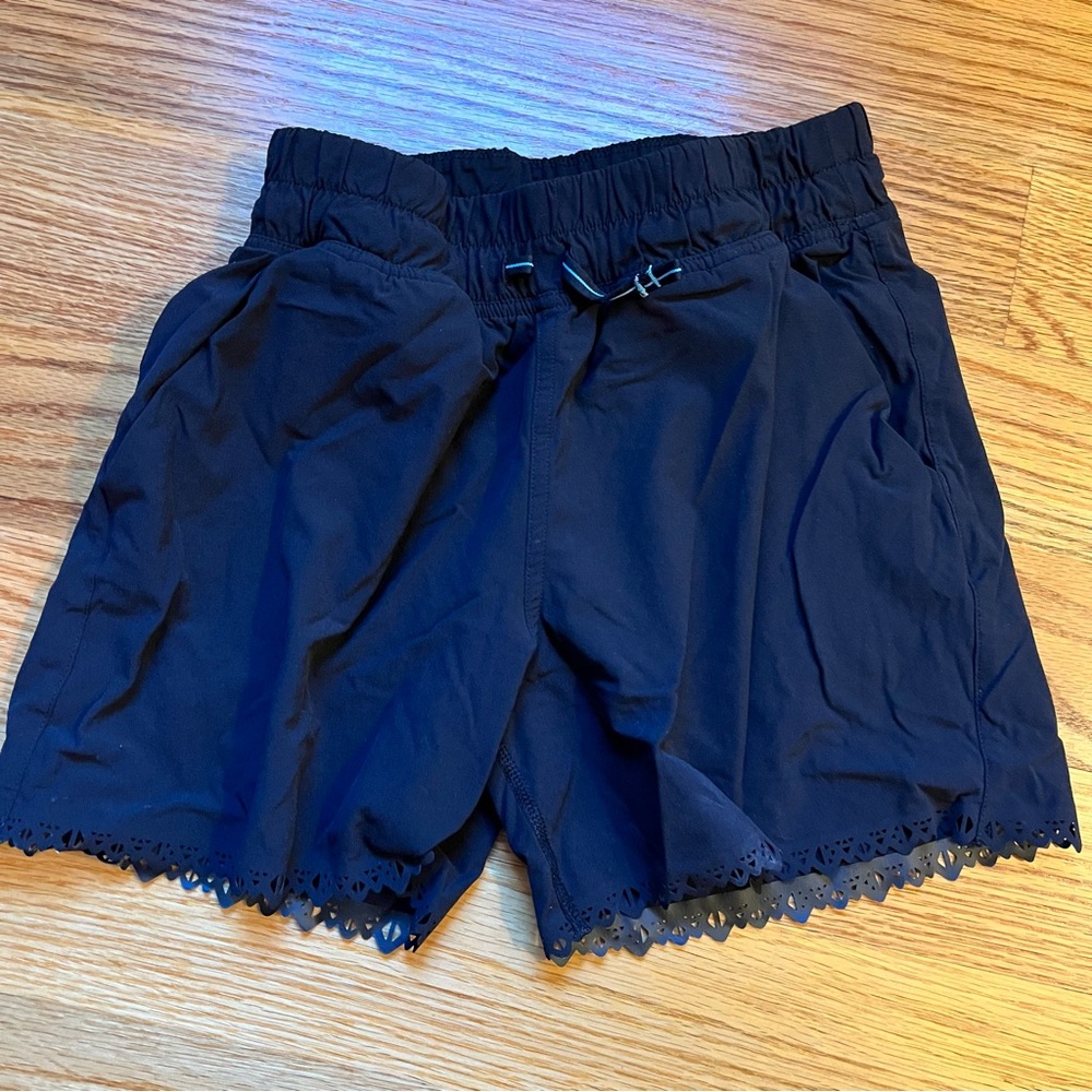 Ivivva black running shorts with laser cut hem size 10